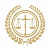 Golden scales of justice within a circle, surrounded by a laurel wreath, on a white background. Symbol of balance and fairness.