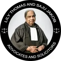 Older person in formal attire is centered in a circular logo with scales of justice. Text reads: Lily Thomas and Saju Jakob, Advocates and Solicitors.