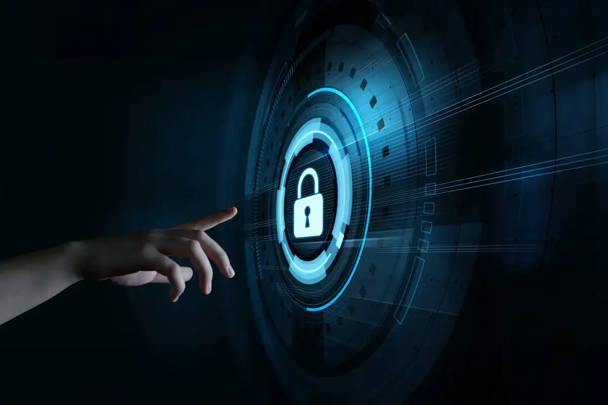 A hand reaches towards a glowing blue lock icon on a digital interface. The background is dark, conveying a sense of security and technology.